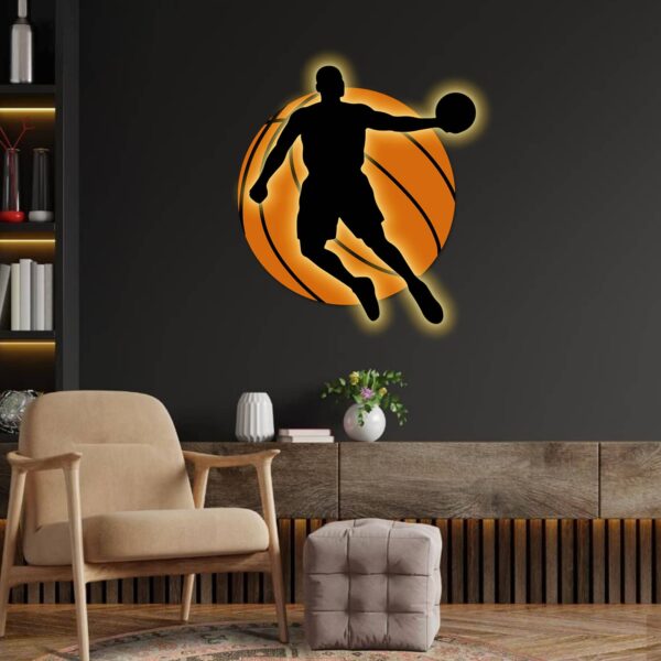 Neon basketball sign illuminating a stylish sports room