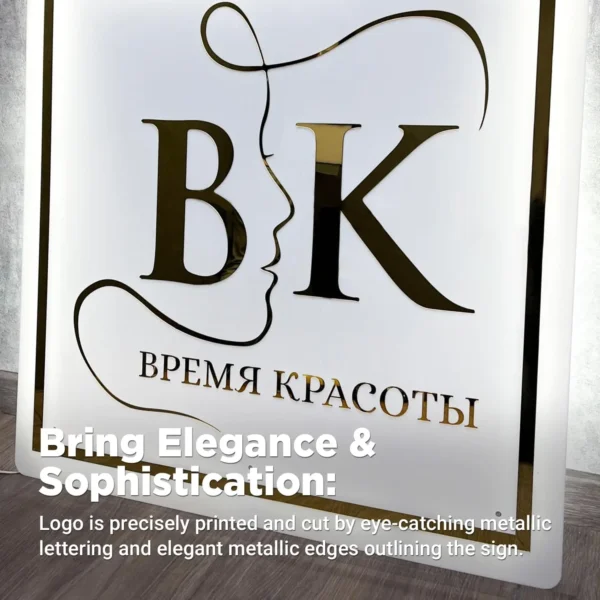 Elegant acrylic sign featuring the "BK" logo with gold metallic lettering and a minimalist line-art face design,