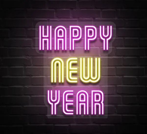 Vibrant neon sign with "Happy New Year" text in bright pink and yellow, perfect for festive celebrations and decor.