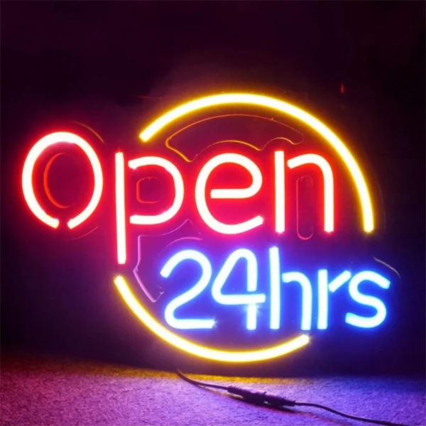 A vibrant Neon Open Sign, with an eye-catching energy-efficient LED design, glows against a dark backdrop in radiant red, yellow, and blue lights displaying Open 24 hrs.